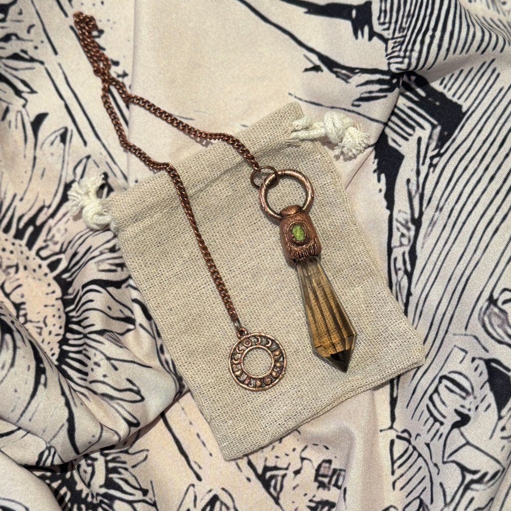 smokey quartz pendulum with peridot jewel handmade by wild and the wolf